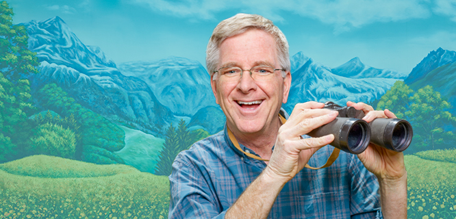 Rick Steves holding binoculars